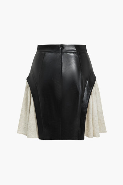 Nerine | Kontrastreicher Kunstleder-Skaterrock mit ausgestellten Stoffeinsätzen und High-Waist-Schnitt