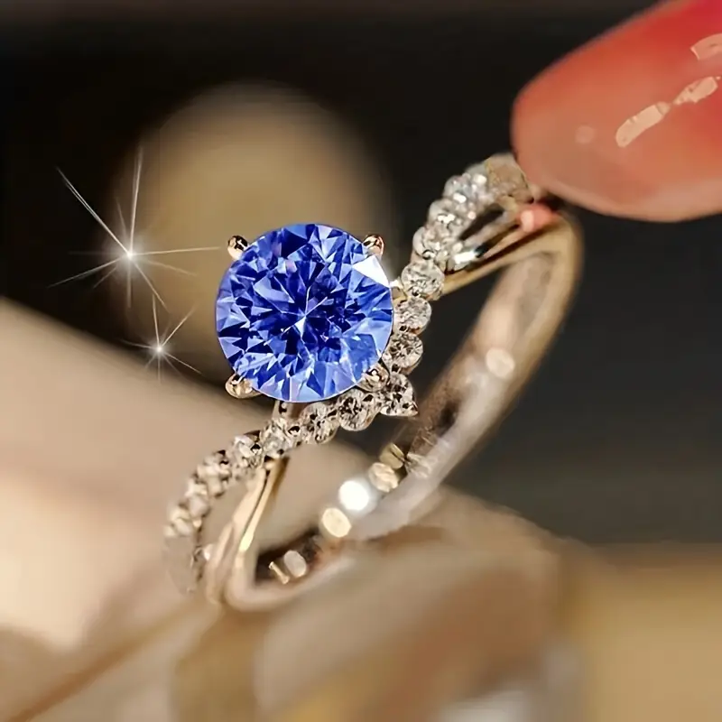 Bezaubernder Ring mit blauem Kristall